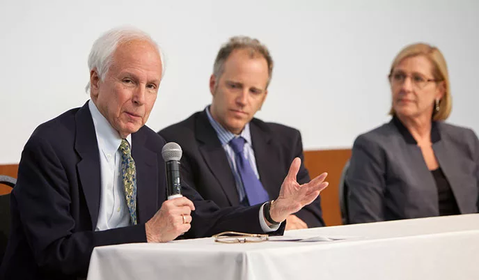 Norm Fost, MD, MPH (left), and Josh Mezrich, MD, respond to questions during a panel discussion.