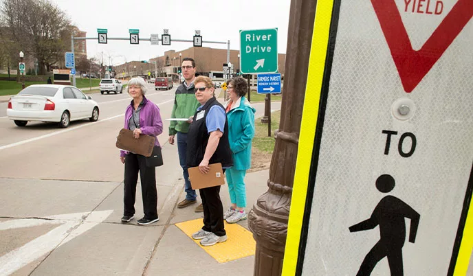 Group of people waiting to cross the street