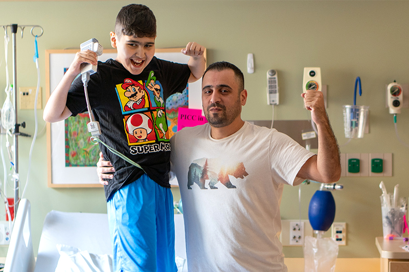 Sezar Almustafa and his son, Sam, show their excitement about Sam's heart transplant