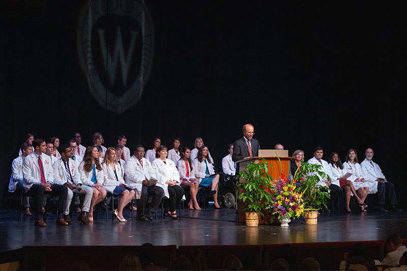 Dean Golden giving a speech on stage