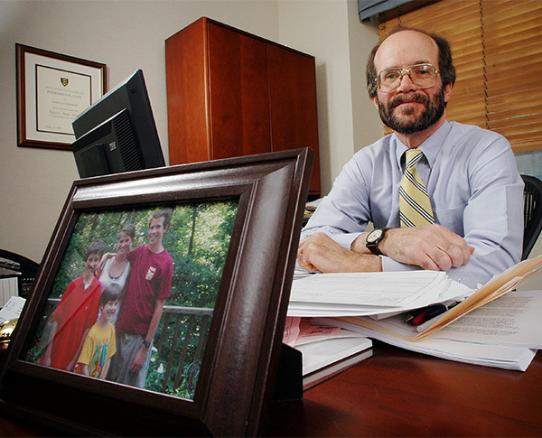 Dean Golden with a framed picture of his family