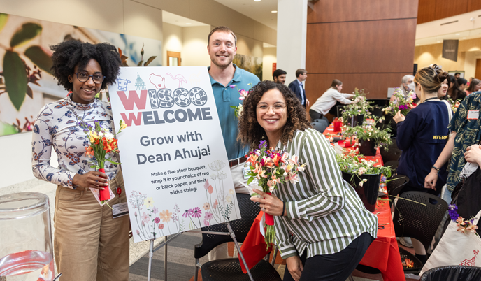 Three guests attend a welcome event