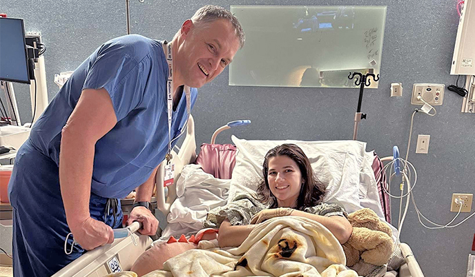 A doctor and patient in a hospital room