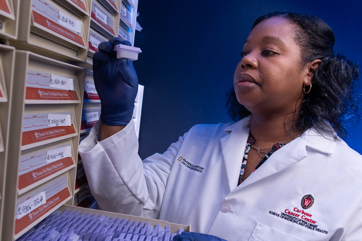 Ella Ward-Shaw holding a tissue sample.