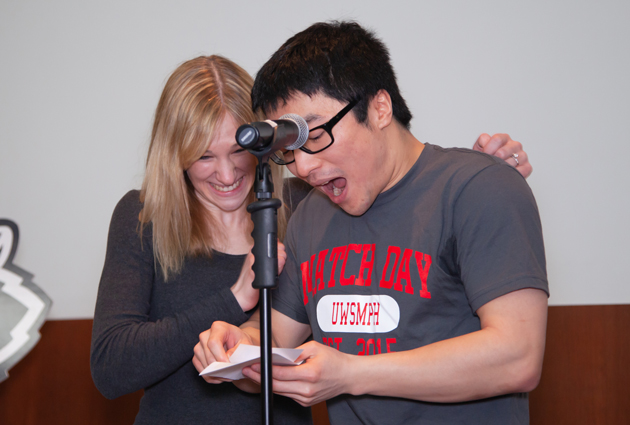A man opens an envelope during a Match Day event