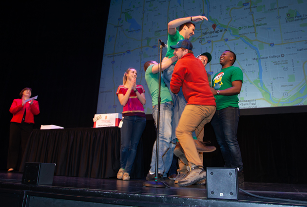 A man in a green shirt jumps up in excitement during a 2017 Match Day event