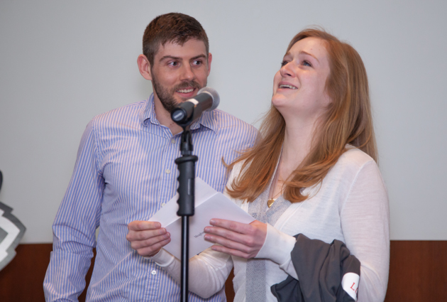 A woman opens an envelope during a Match Day event
