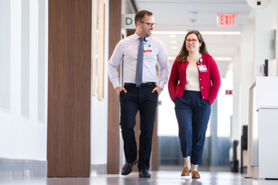 Doctors consult in a sunny hallway at UW Health Eastpark Medical Center.