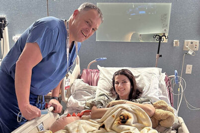 A doctor and patient in a hospital room