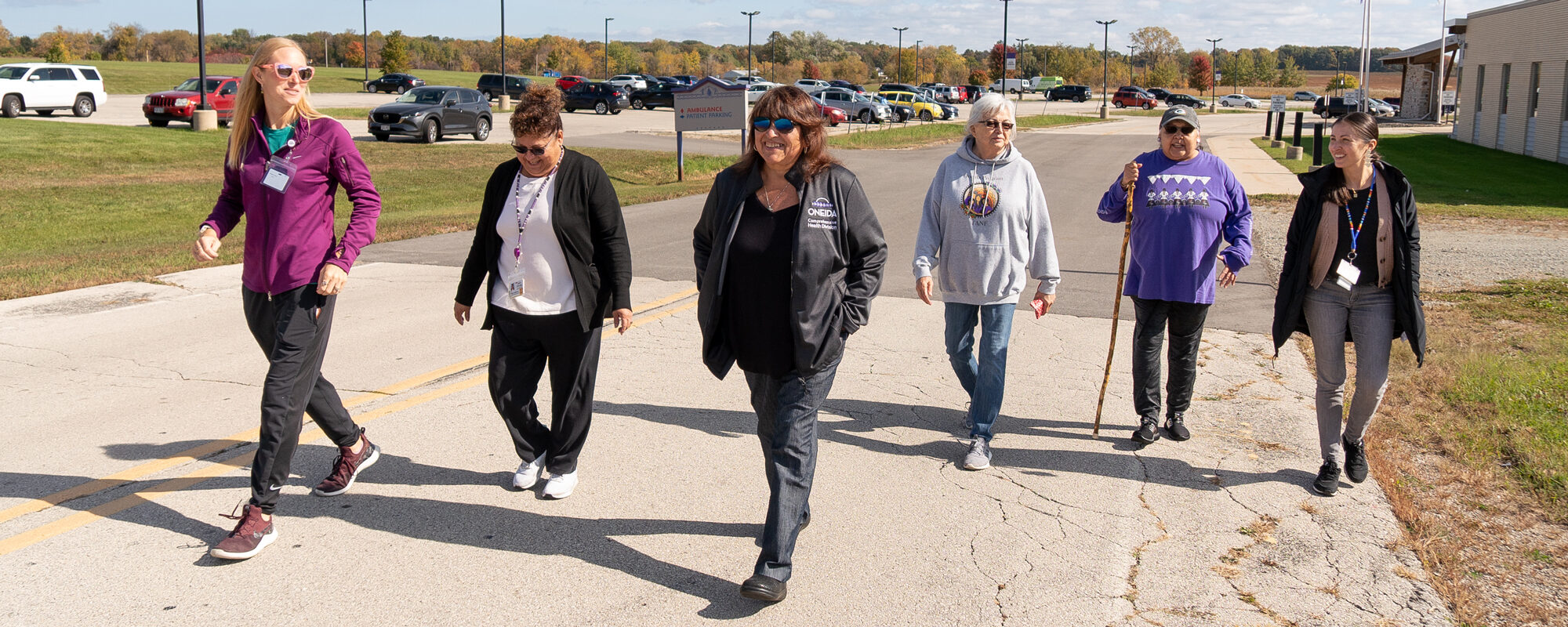 A group of people walk outside