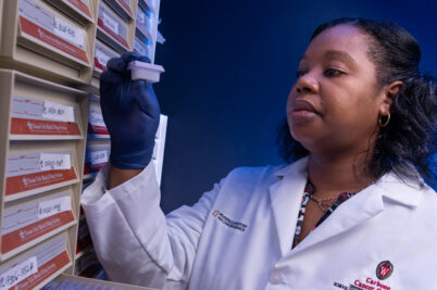 Researcher holding a sample from a lab