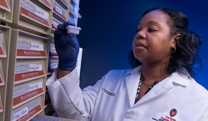 Researcher holding a sample from a lab