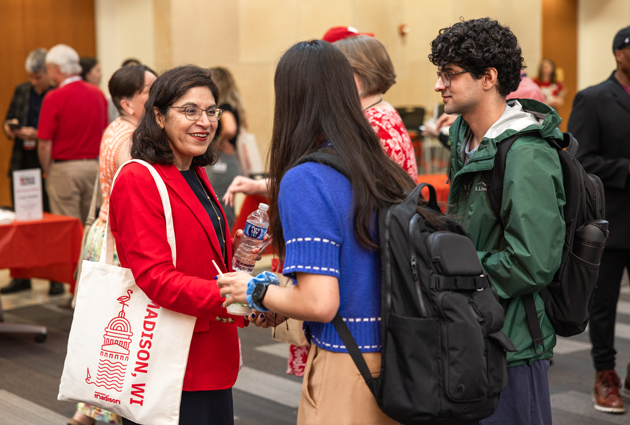 Two people shake hands
