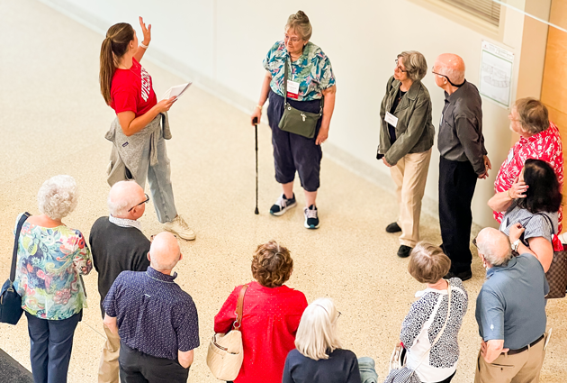 A student leading a facility tour