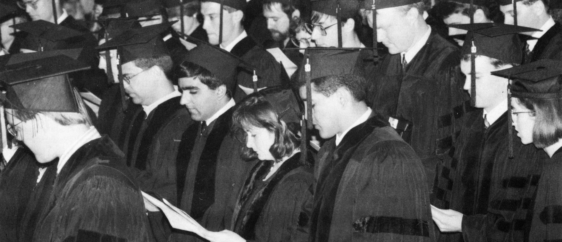 A side view of graduates at a graduation event