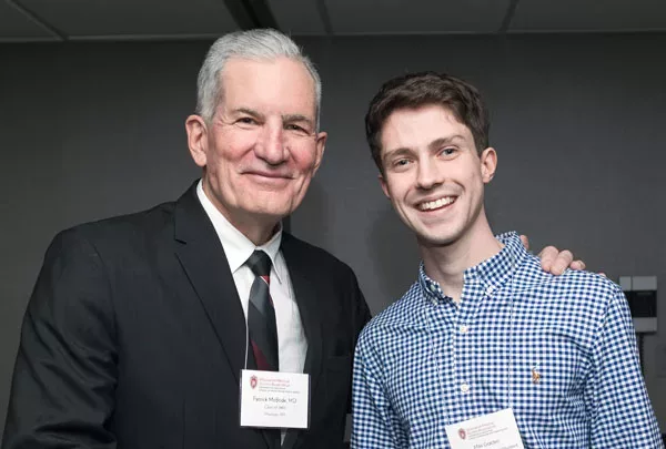 Patrick McBride and Max Golden smiling at a student scholarship reception