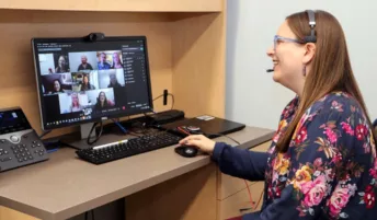 A woman enjoying a group video conference