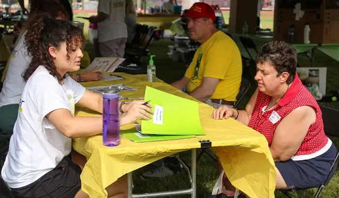 People meeting at an event registration table