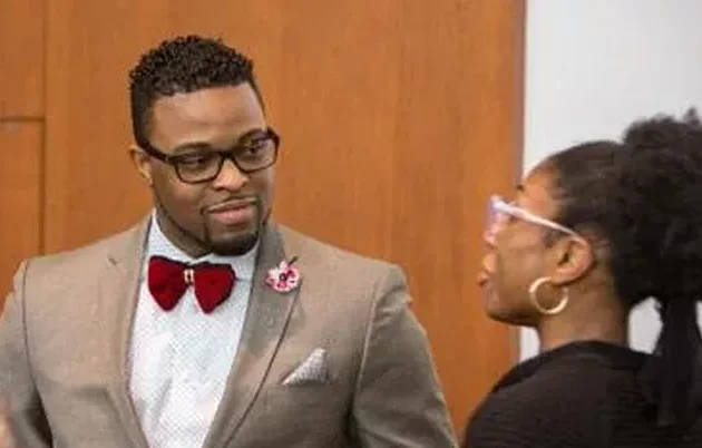 Two people talking at an academic conference