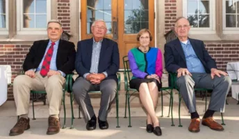 Four donors sitting next to each other and looking at the camera