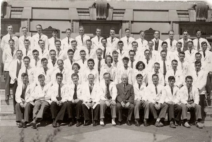 The Class of 1942 in their white coats
