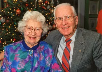 An older couple smiling together for the camera