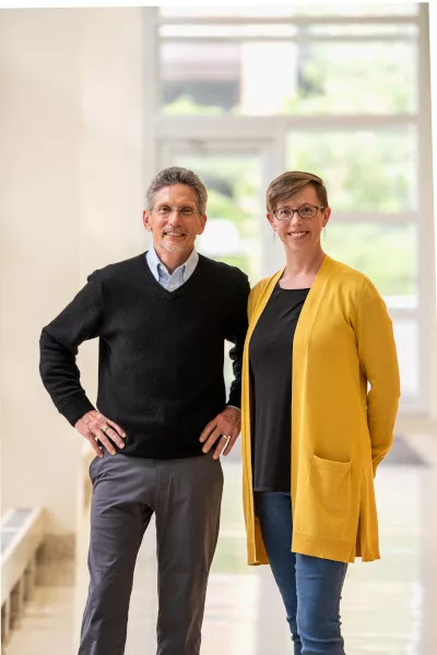 Two doctors posing together who are father and daughter