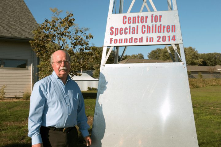 Dr. James DeLine in front of the Center for Special Children