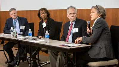 Four people leading a panel discussion