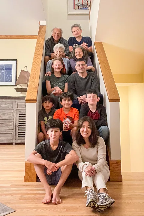 A family posing on a staircase
