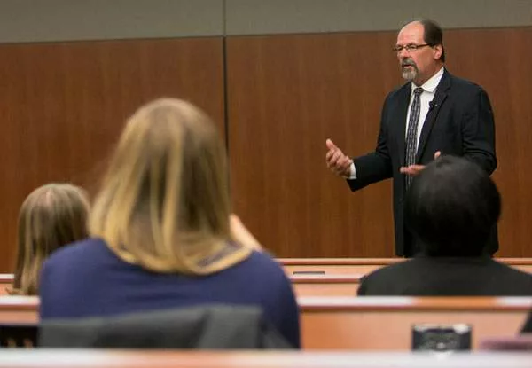 A lecturer talking to medical students