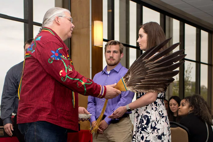A student receiving a native blessing