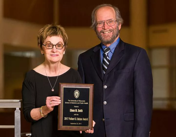 Smith and Dean Golden posing with the Belzer Award plaque