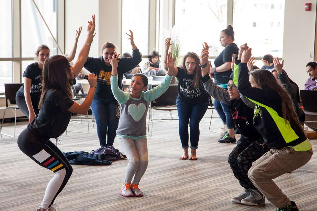 Students in a standing yoga pose