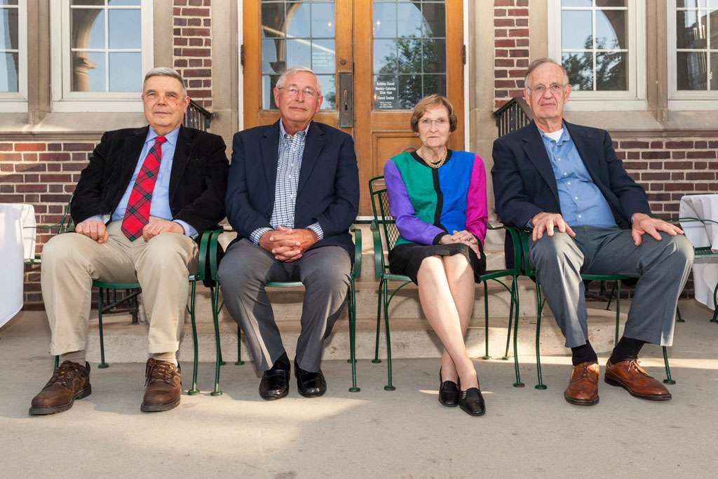 Four donors sitting next to each other and looking at the camera